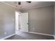 Bedroom with a ceiling fan, neutral walls, and wood-look flooring at 2500 Courtland Dr, Sanford, NC 27330