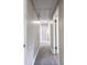 Hallway with gray walls and wood-look flooring leads to various rooms of the house at 2500 Courtland Dr, Sanford, NC 27330