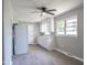 This kitchen features a ceiling fan and classic white cabinets at 2500 Courtland Dr, Sanford, NC 27330