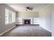 Bright living room featuring a classic fireplace with built-in shelving and large windows at 2500 Courtland Dr, Sanford, NC 27330