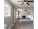 Open-concept living room featuring a fireplace, built-in shelving, and lots of natural light at 2500 Courtland Dr, Sanford, NC 27330