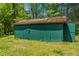 Exterior of a green shed with a rusty roof, surrounded by grass at 2500 Courtland Dr, Sanford, NC 27330
