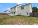 This home features a spacious backyard with a white fence and a deck at 281 Highland Forest Dr, Sanford, NC 27332