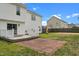 Exterior view of a home's backyard with a brick patio and wooden deck at 281 Highland Forest Dr, Sanford, NC 27332