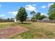 Large, fenced backyard featuring a patio area and mature trees for privacy at 281 Highland Forest Dr, Sanford, NC 27332