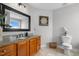 Lovely bathroom with granite countertops, tile floors, and wood cabinetry at 281 Highland Forest Dr, Sanford, NC 27332