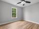 Bedroom featuring hardwood floors, neutral walls, and ceiling fan at 281 Highland Forest Dr, Sanford, NC 27332