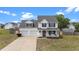 Charming two-story home featuring a welcoming front porch and attached two-car garage at 281 Highland Forest Dr, Sanford, NC 27332
