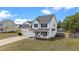 Charming two-story home featuring a welcoming front porch and attached two-car garage at 281 Highland Forest Dr, Sanford, NC 27332