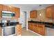 Functional kitchen with stainless steel appliances and wooden cabinetry at 281 Highland Forest Dr, Sanford, NC 27332