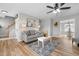 Comfortable living room with modern decor, ceiling fan, and access to stairs at 281 Highland Forest Dr, Sanford, NC 27332