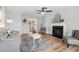 Inviting living room with fireplace, ceiling fan, and ample seating at 281 Highland Forest Dr, Sanford, NC 27332
