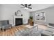 Bright living room featuring a fireplace and a cozy seating area at 281 Highland Forest Dr, Sanford, NC 27332