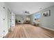 Bright living room with light wood floors, ceiling fan, and plenty of natural light at 281 Highland Forest Dr, Sanford, NC 27332