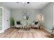 Living room featuring hardwood floors, neutral walls, ceiling fan and seating at 281 Highland Forest Dr, Sanford, NC 27332