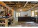 Unfinished basement with exposed ceiling, walkout access, and lounge area at 2917 Ericka Dr, Hillsborough, NC 27278