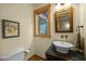 Charming powder room features a unique vanity sink and a framed mirror adding character at 2917 Ericka Dr, Hillsborough, NC 27278