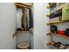 Organized closet with wooden shelves and hanging rods at 2917 Ericka Dr, Hillsborough, NC 27278