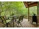 Relaxing outdoor space with a table and chairs surrounded by lush greenery at 2917 Ericka Dr, Hillsborough, NC 27278