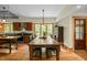 Bright dining area with a large wooden table next to the kitchen, perfect for Gathering meals at 2917 Ericka Dr, Hillsborough, NC 27278