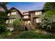 Charming multi-level home with wooden deck, lush greenery, and flowering shrubs at 2917 Ericka Dr, Hillsborough, NC 27278