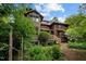 Stunning multi-level home nestled among lush greenery, with rustic wood and ample windows at 2917 Ericka Dr, Hillsborough, NC 27278