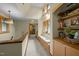 Upstairs hallway with a built-in window seat and open shelving, perfect for a reading nook at 2917 Ericka Dr, Hillsborough, NC 27278