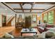 Cozy living room featuring a beamed ceiling, comfortable seating and an inviting layout at 2917 Ericka Dr, Hillsborough, NC 27278