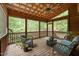 Inviting screened porch with wood floors, ceiling fan, and views of surrounding greenery at 2917 Ericka Dr, Hillsborough, NC 27278