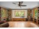 Cozy sitting area featuring a window seat, ceiling fan, and built-in bookcases offering space at 2917 Ericka Dr, Hillsborough, NC 27278