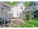 The backyard has a screened-in porch and brick patio perfect for outdoor entertaining at 304 Parkridge Dr, Clayton, NC 27527