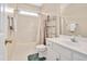 Bathroom with a shower/tub combo, toilet, vanity, and open shelving at 304 Parkridge Dr, Clayton, NC 27527