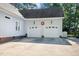 Spacious two-car garage with ample parking and additional side yard space at 304 Parkridge Dr, Clayton, NC 27527