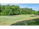 View of the lush green golf course with mature trees at 304 Parkridge Dr, Clayton, NC 27527