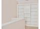 Hallway featuring built in bookshelf with overhead lighting at 304 Parkridge Dr, Clayton, NC 27527