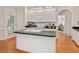 Open kitchen with white cabinets, a center island, and plenty of counter space at 304 Parkridge Dr, Clayton, NC 27527