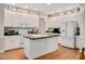 Bright kitchen with white cabinetry, appliances, and ample storage space at 304 Parkridge Dr, Clayton, NC 27527