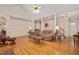 Spacious living room with hardwood floors, columns, and a comfortable seating area at 304 Parkridge Dr, Clayton, NC 27527
