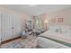 Charming bedroom with hardwood floors and natural light features neutral walls and bright trim at 305 Clarendon Cres, Raleigh, NC 27610