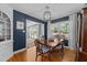 Traditional dining room featuring a wooden table, blue walls, and natural light at 305 Clarendon Cres, Raleigh, NC 27610