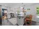Bright kitchen with white cabinetry, stainless steel appliances, and granite countertops at 305 Clarendon Cres, Raleigh, NC 27610