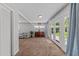 Open concept living room featuring french doors and neutral walls and trim at 305 Clarendon Cres, Raleigh, NC 27610