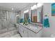 Bright bathroom with a large shower, double vanity, and modern fixtures at 305 Clarendon Cres, Raleigh, NC 27610
