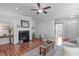 Cozy living room with fireplace, wood floors, and natural light at 3148 Rapid Falls Rd, Cary, NC 27519