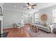 Inviting living room featuring a fireplace, gray sofa, and a decorative wall basket at 3148 Rapid Falls Rd, Cary, NC 27519