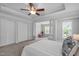 Spacious main bedroom featuring carpet flooring, a tray ceiling, and an adjacent sitting area at 3148 Rapid Falls Rd, Cary, NC 27519