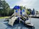 Colorful playground with slides, climbing structures, and a safety surface for ' fun at 3148 Rapid Falls Rd, Cary, NC 27519