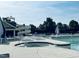 Community pool area with a slide, hot tub, and lounge chairs for Gathering enjoyment at 3148 Rapid Falls Rd, Cary, NC 27519