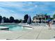 A community swimming pool with lounge chairs for relaxation on a sunny day at 3148 Rapid Falls Rd, Cary, NC 27519