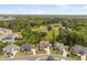 Sprawling aerial view of a neighborhood, vineyard, and forested landscape at 3215 Bellamy Ridge Dr, Apex, NC 27523